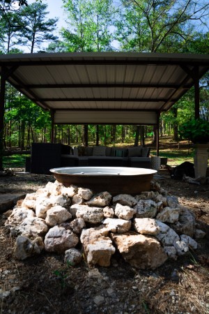 Quartz crystal fire pit with covered family seating area behind
